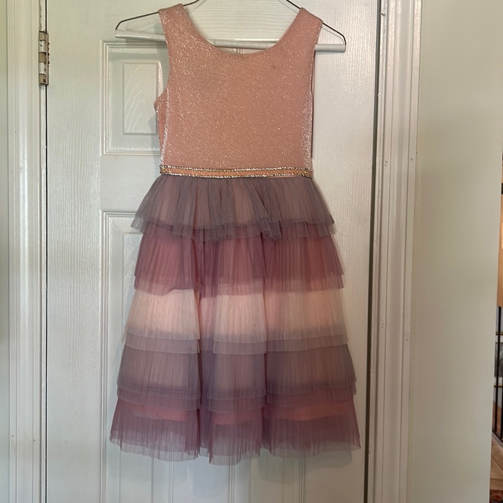 Beautiful dress.  Small makeup stain that can barely be seen. Seldom worn.